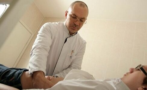 a doctor examines a patient with prostatitis